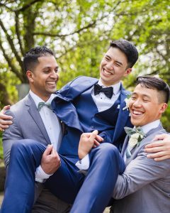 Groomsmen posing naturally at Madison Greenhouse