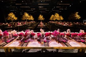 Reception table design with refined floral arrangements at Cedar Event Centre
