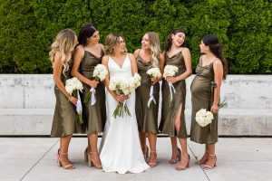 Bride and bridesmaids chatting at Aga Khan Museum during a wedding photoshoot in Toronto