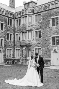 Bride and groom share a kiss on the lawn outside Knox College.